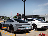 Grey Porsche 911 GT3 Touring and White Taycan