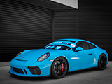 Blue Porsche 911 GT3 Touring with Manchester United Gear