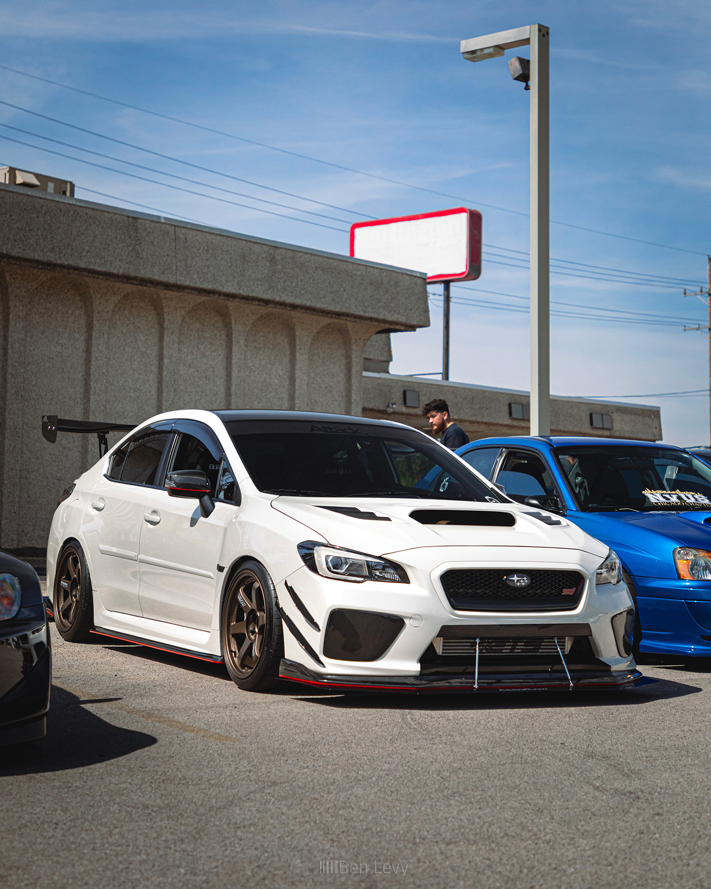 White Subaru WRX STI with Red Accent on Lips and Sideskirts
