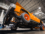 Orange Lowrider Malibu on Three Wheels