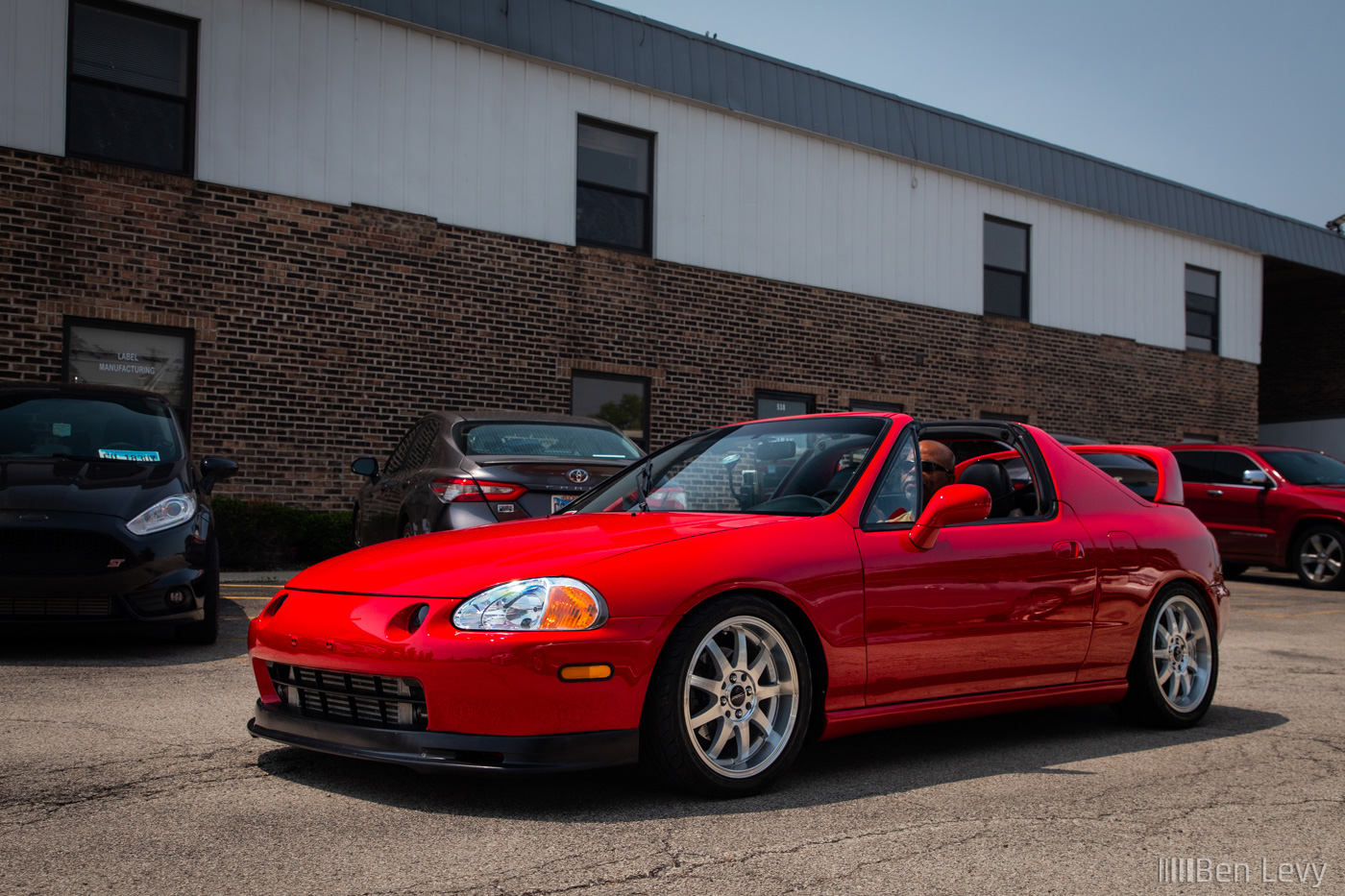 Red Honda del Sol at the Sound Performance Open House