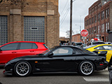 Black Mazda RX-7 outside of Midwest Performance Cars in Chicago