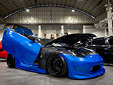Bagged Blue Nissan 370Z with Carbon Fiber Fenders