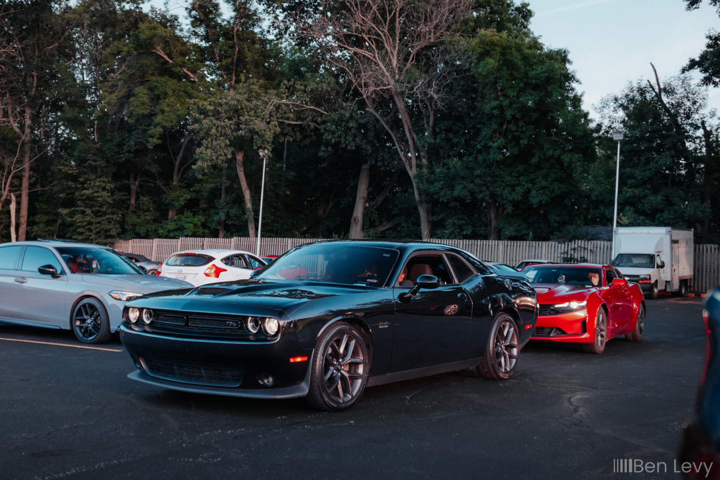 Challenger R/T and Camaro leaving a car meet