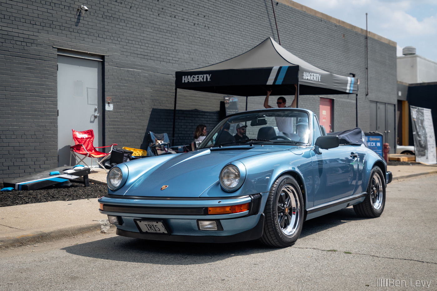 Iris Blue Porsche 911 Cabriolet leaving Checkeditout Chicago in 2024