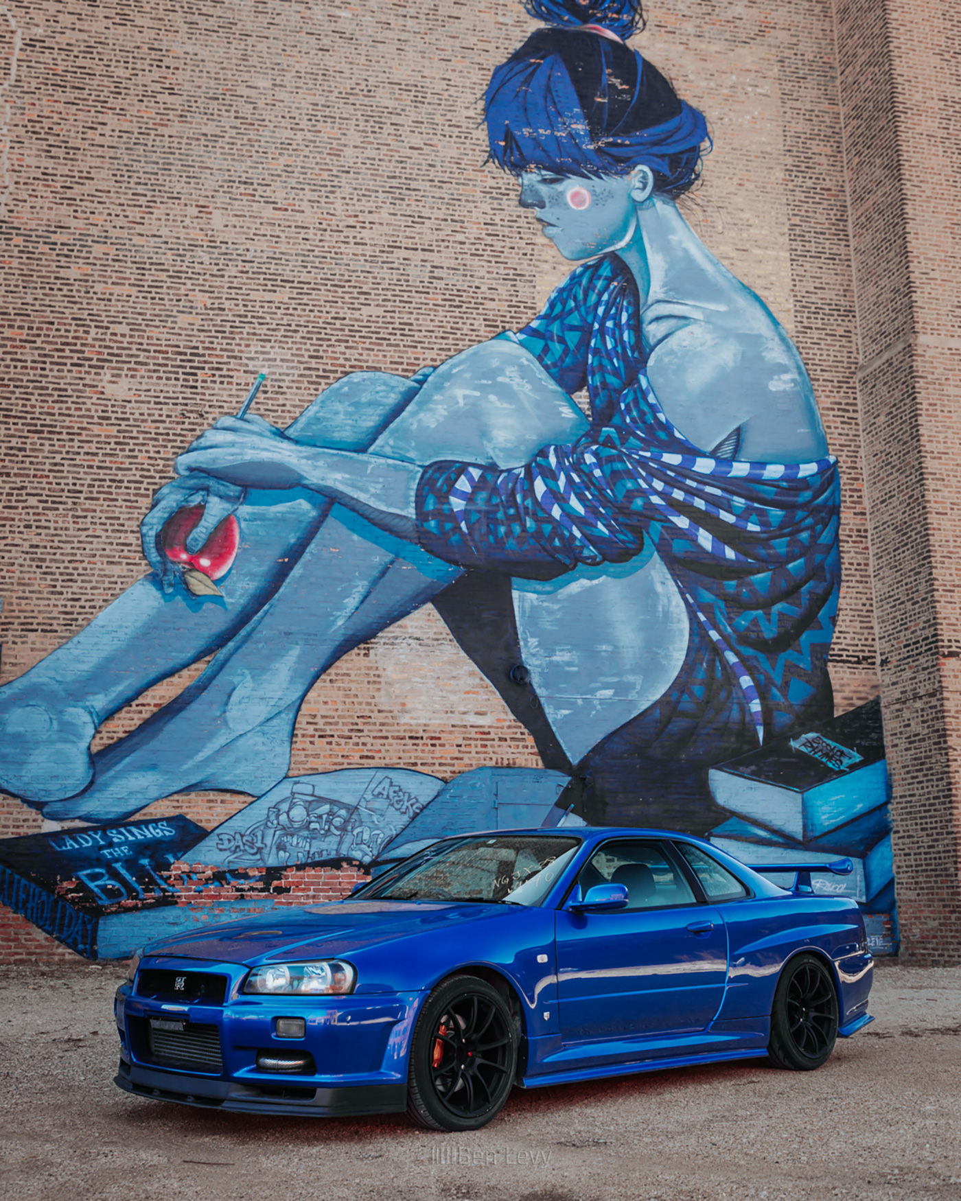 Blue R34 Nissan Skyline in front of Mural in Pilsen, Chicago