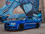 Blue R34 Nissan Skyline in front of Mural in Pilsen, Chicago