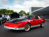 Red Pontiac Trans Am with Big Hood Bulge