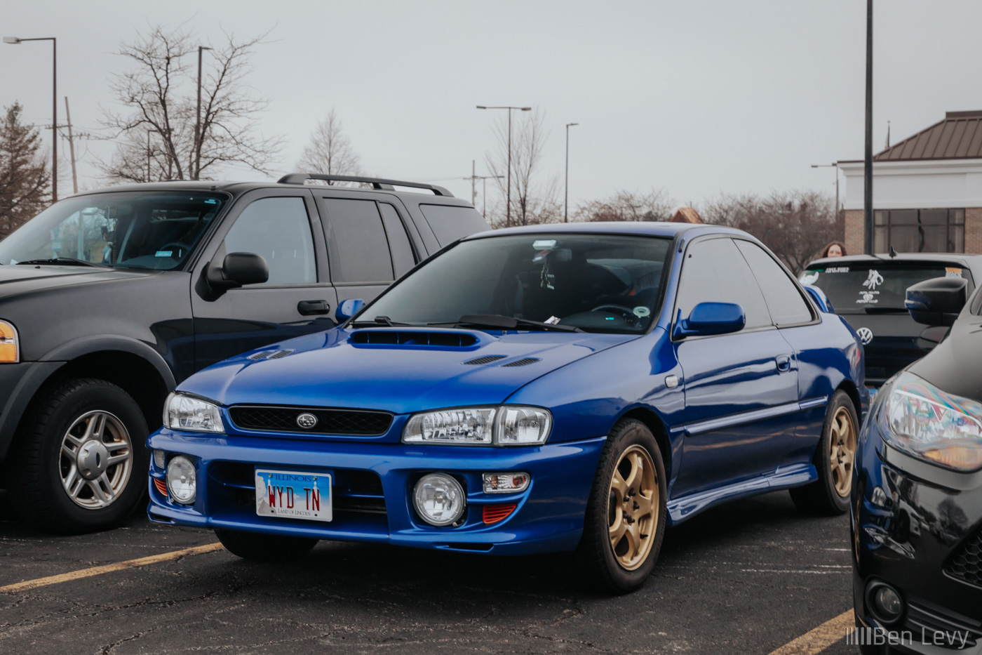 Blue Impreza RS Coupe on Gold Wheels