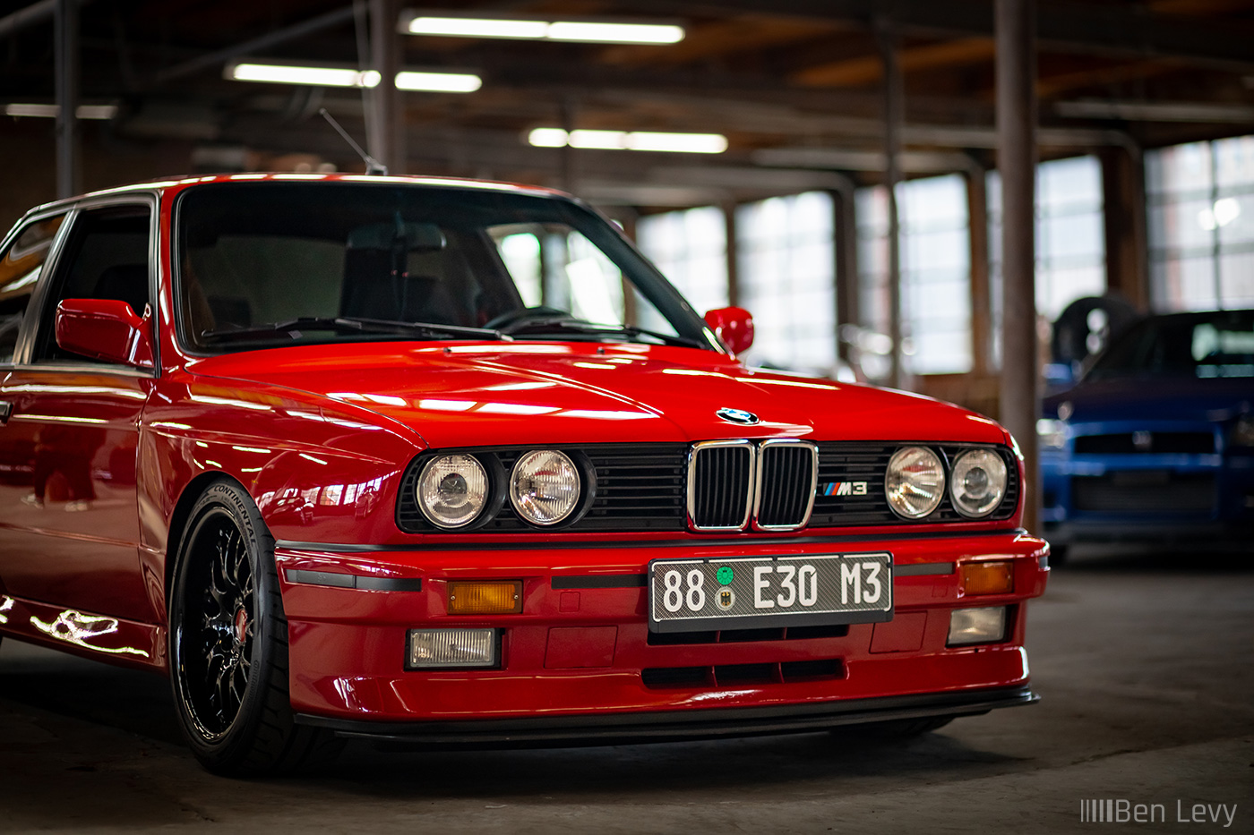 Front of Red BMW M3 in a Warehouse in Chicago