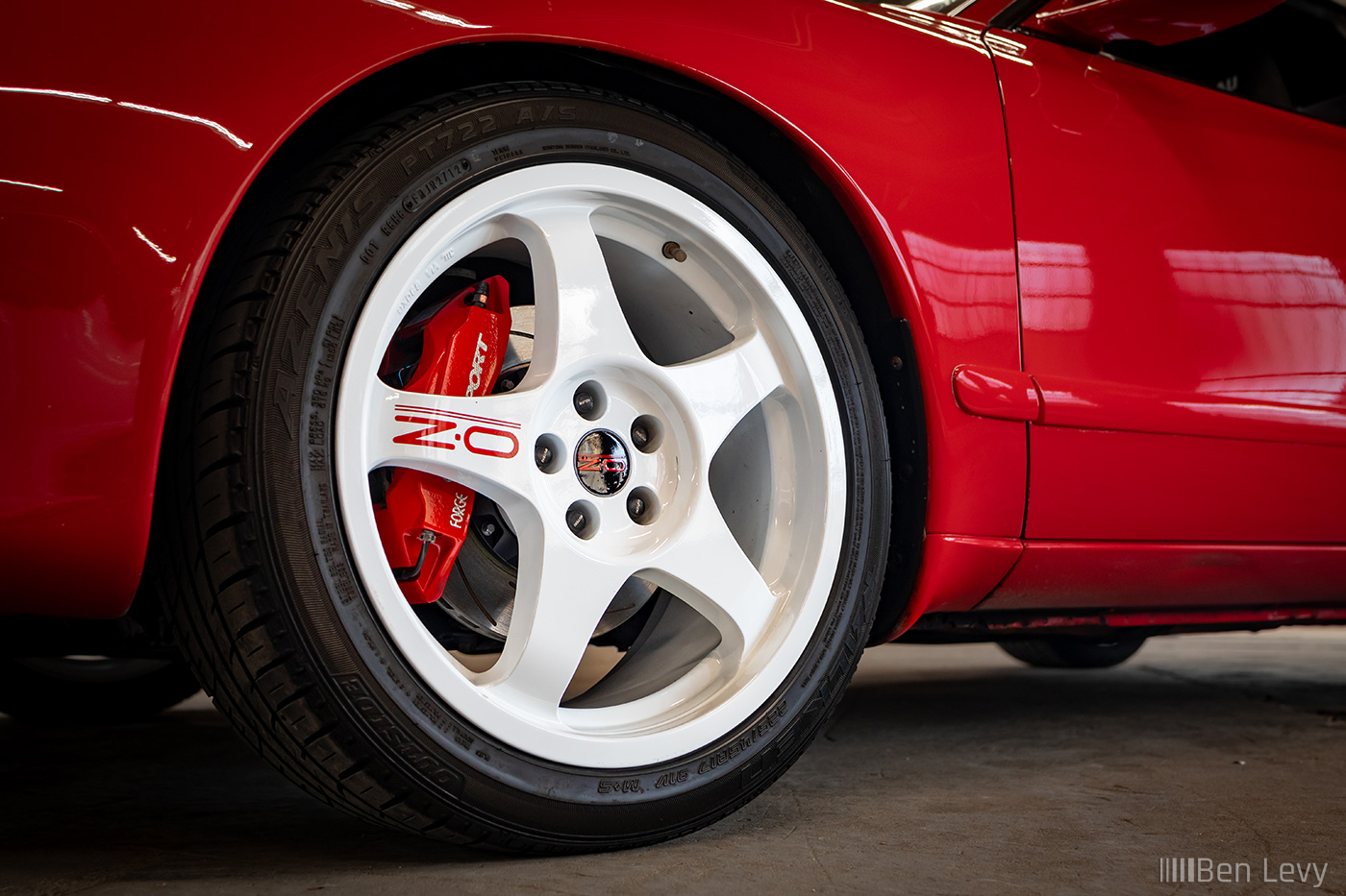 White OZ Racing Wheels on Red Toyota Celica All-Trac
