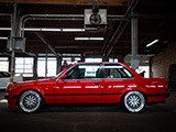 Side of Red E30 BMW Coupe