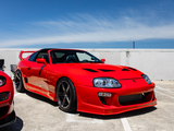 Red Mk4 Toyota Supra at a Parking Garage Car Meet