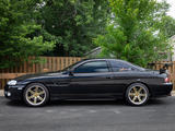 Side of Black Lexus SC300 with Gold Wheels