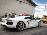 White Lamborghini Aventador leaving a car show in Naperville, IL