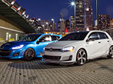 Mazdaspeed3 and GTI against the Chicago Skyline