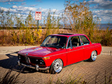 Red BMW 2002 on the North Shore