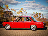 Side of a red BMW 2002