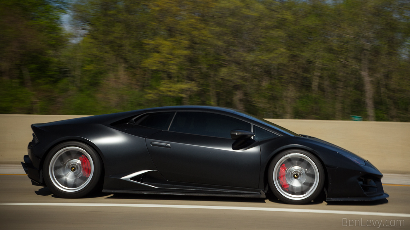 Black Lamborghini Huracan on the highway