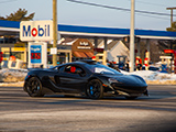 Black McLaren 600LT driving through Woodridge, IL