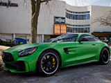 Green AMG GT R Coupe outside of a Neiman Marcus