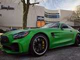 Green Mercedes-AMG GT R ourside of a mall