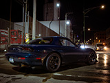 Green Mazda RX-7 in Chicago at Night