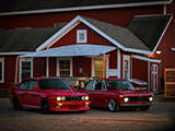 Red BMW M3 and 2002 in Front of Farmhouse