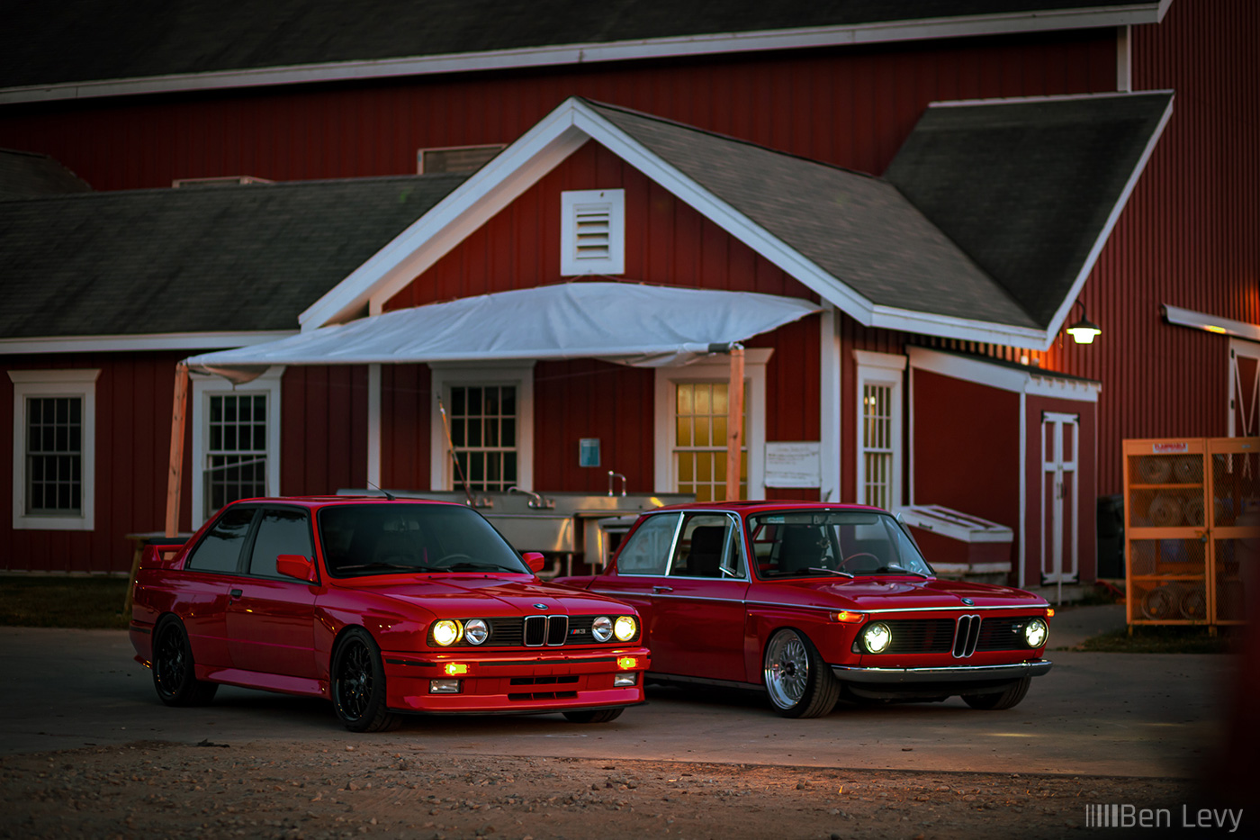 Red BMW M3 and 2002 in Front of Farmhouse