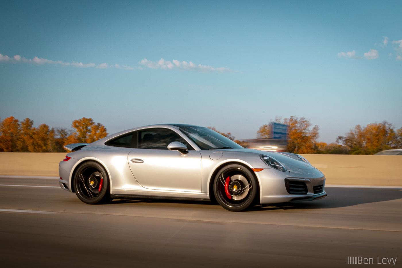 Silver Porsche 911 on the Highway