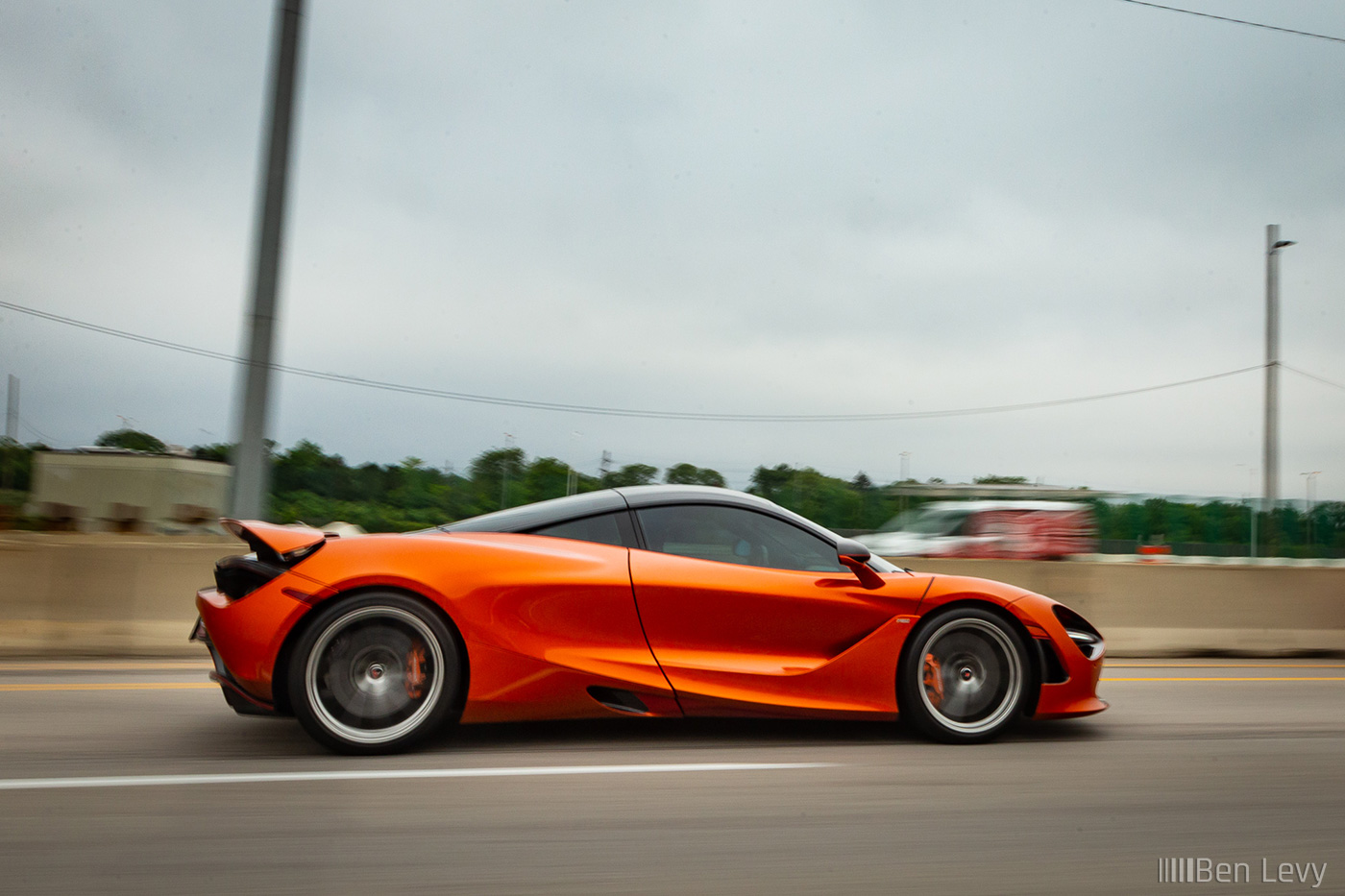 Orange McLaren 720S on the Highway