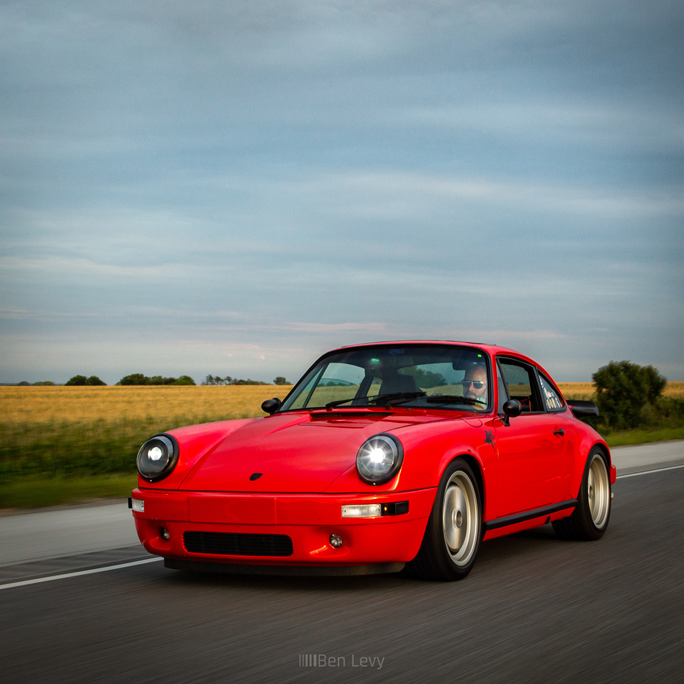 Red Porsche 911 Driving Along Indiana Wheatfields