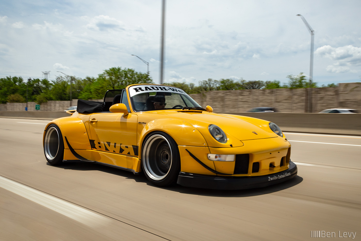Wide Fenders on Yellow Porsche 911 on the Highway