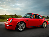 Rolling Shot of Red Porsche 911 on Indiana Highway