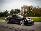 Rolling Pic of Black Porsche 997 with Aerokit
