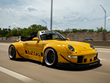 Wide Fenders on Yellow Porsche 911 on the Highway