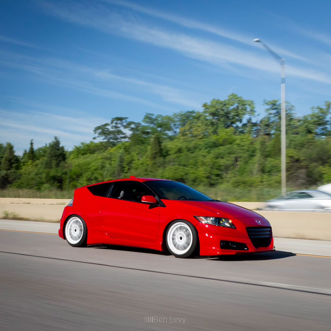 Red Honda CR-Z on the Highway