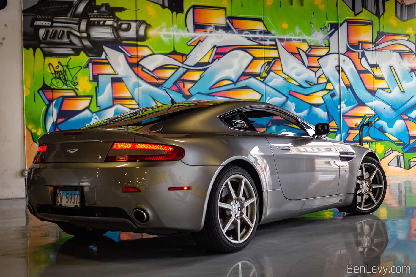 Aston Martin Vantage in front of grafitti