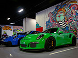 Blue and Green Porsche 911 GT3s