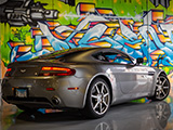 Aston Martin Vantage in front of grafitti