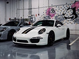 White Porsche 911 with Black Stripes at Alpha Garage