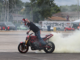 One-handed motorcycle burnout