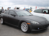 Lowered Mazda RX-8 with flat black paint