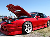 Red S13 Nissan with Risky Devil