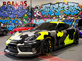 Camo Porsche GT4 in Front of Graffiti