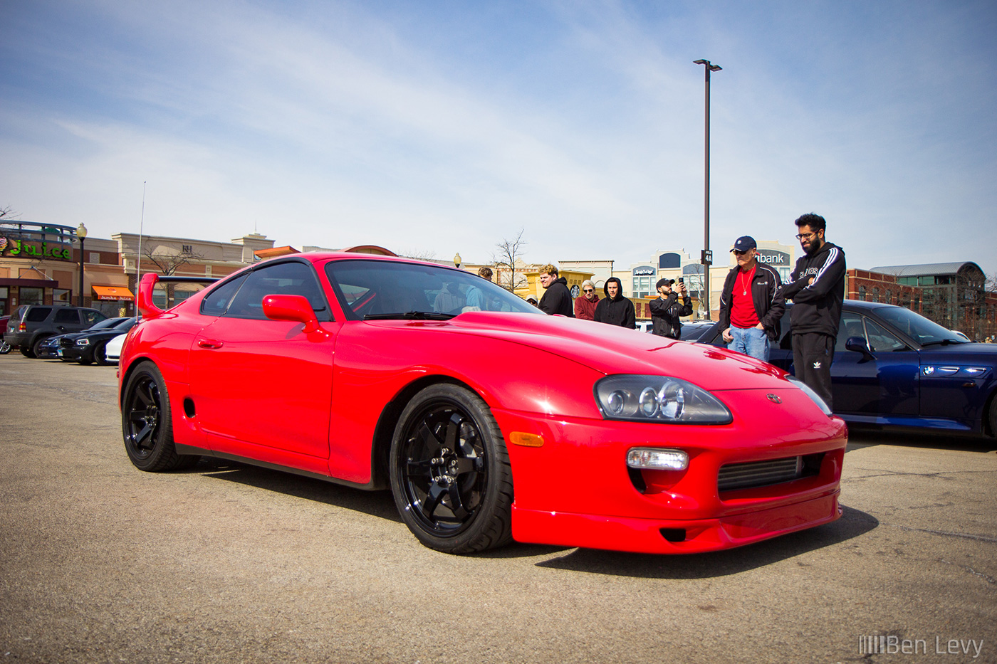 Red Toyota Supra with Black Wheels