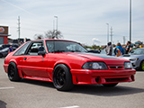 Red Foxbody Mustang with Smoked Headlights