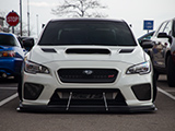 Front of White Subaru WRX STI with Blocked Out Foglights
