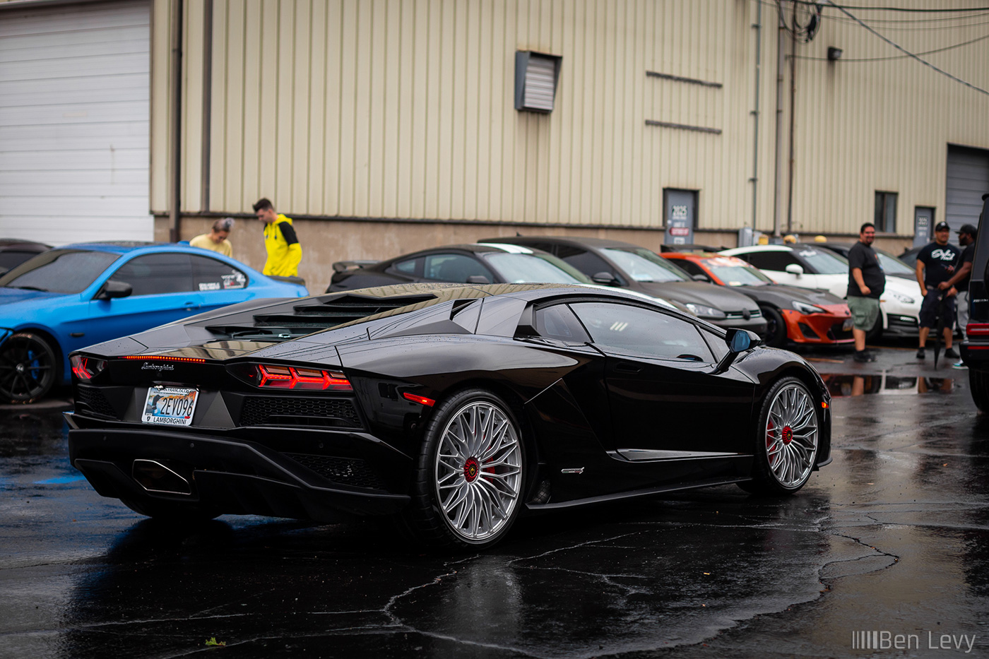 Black Lamborghini Aventador S out on a rainy day