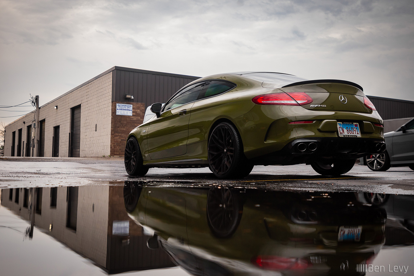 Green AMG C43 with its Reflection
